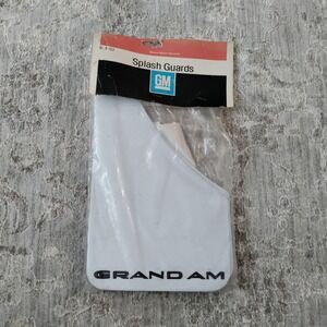 Nos GM splash guards Mud Flaps Pontiac Grand Am White w/black letters 999194